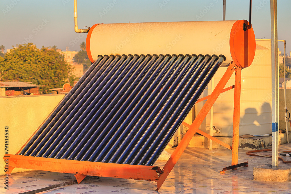 View of vacuum air collector Solar water heater and tank on roof of a house ...