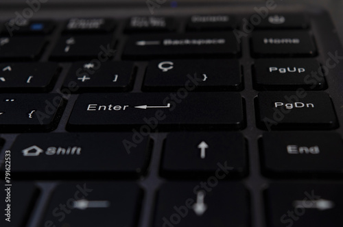 closeup of enter key, selective focus of enter key on notebook keyboard