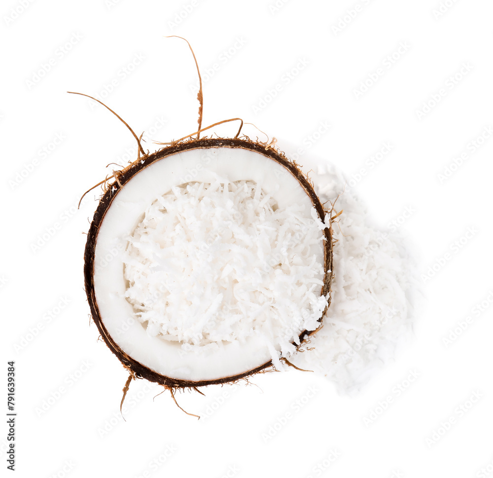 Naklejka premium Coconut flakes in nut shell isolated on white, top view