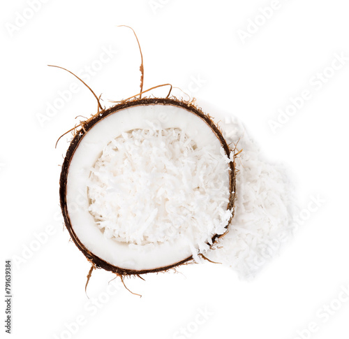 Coconut flakes in nut shell isolated on white, top view