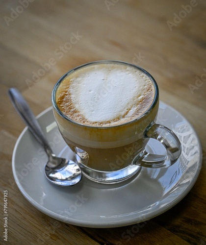 Isolated high resolution large of a single steaming hot coffee cup preparation- cappuccino in a restaurant- Israel