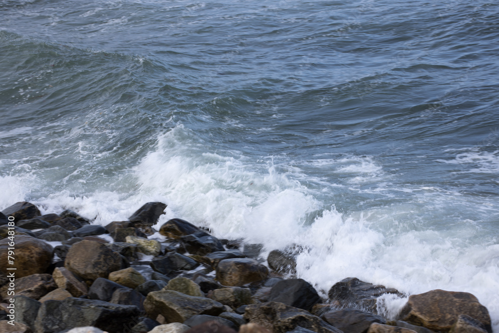 Ocean waves splashing on a rocky shore