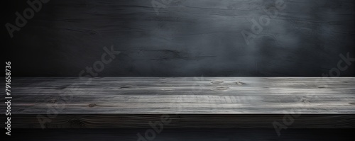 Abstract background with a dark gray wall and wooden table top for product presentation, wood floor, minimal concept, low key studio shot