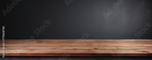 Abstract background with a dark gray wall and wooden table top for product presentation, wood floor, minimal concept, low key studio shot