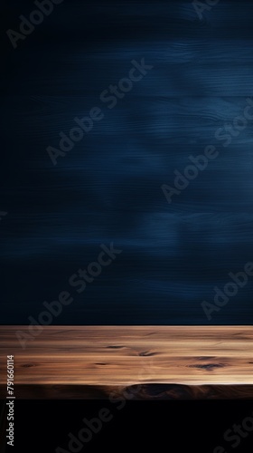 Abstract background with a dark indigo wall and wooden table top for product presentation, wood floor, minimal concept, low key studio shot