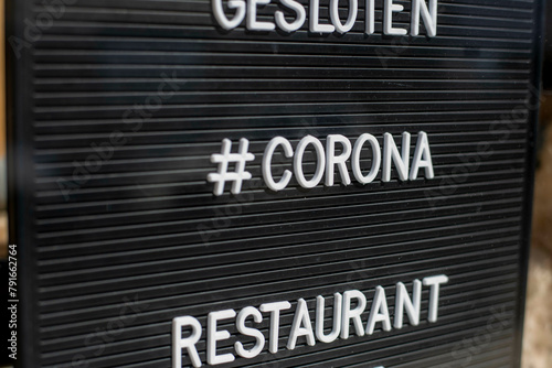 Sign indicating restaurant closure due to Corona. photo