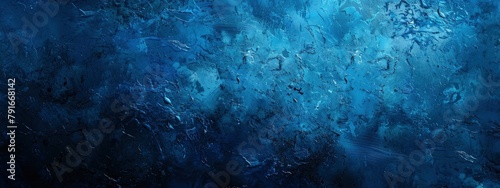 Abstract blue grunge background texture with dark smudges and stains