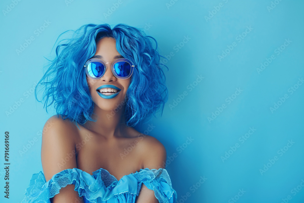 Φωτογραφία beautiful african woman with blue hair in blue sunglasses and blue dress over bl