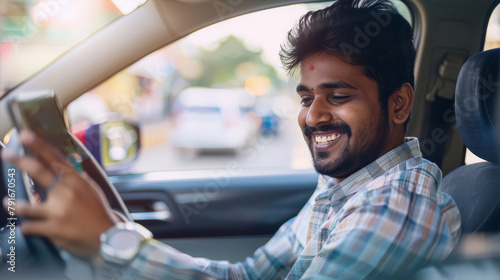 Indian man using smartphone while driving car © AdnanArif