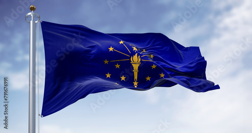 Indiana state flag waving in the wind on a clear day photo