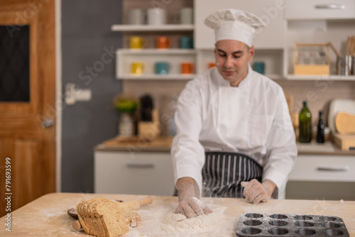 Professional chef kneads dough with expertise. Art of bread-making in a bustling commercial kitchen