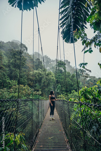 Jungle adventure on a hanging bridge in Costa Rica photo