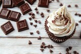 Delicious cupcake with white frosting and chocolate chips, perfect for bakery or dessert concept