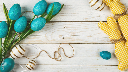 Happy Easter concept. Preparation for holiday. Easter eggs isolated on wooden background. Simple minimalist flat lay top view copy space
