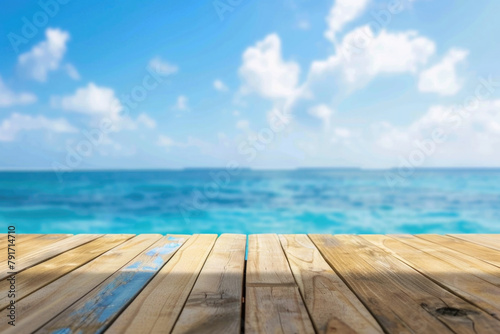 Summer tropical beach with waves and blue sky with clouds. Holiday vacation background with empty wooden table