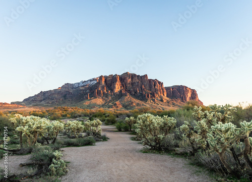 Evening panorama of the Superstition Mountains in Arizona and clear blue sky. photo