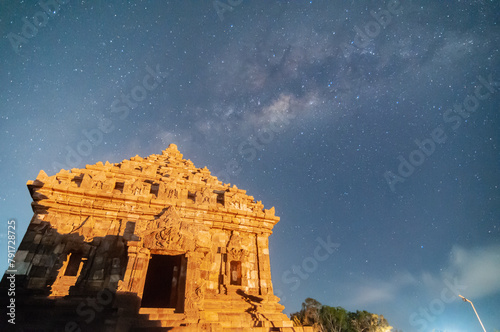 Sleman, Indonesia - July 14,  2015. Milky Way galaxy stretches in the sky Sleman with the foreground of the ijo temple photo