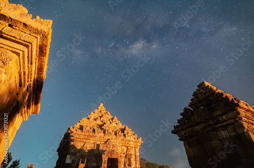 Sleman, Indonesia - July 14,  2015. Milky Way galaxy stretches in the sky Sleman with the foreground of the ijo temple photo