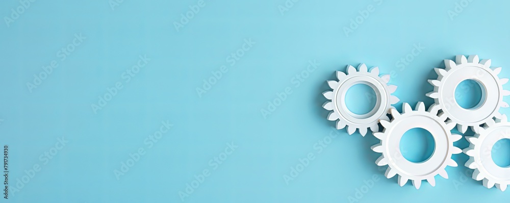 Three white gears on a Blue background, laid flat, copy space concept for business technology and development in the abstract vector with copy space for photo text or product, blank empty copyspace