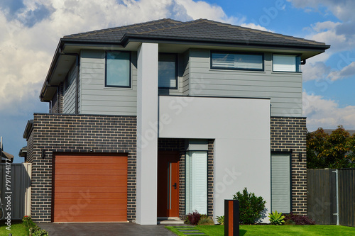 A modern home in the suburbs on a sunny afternoon