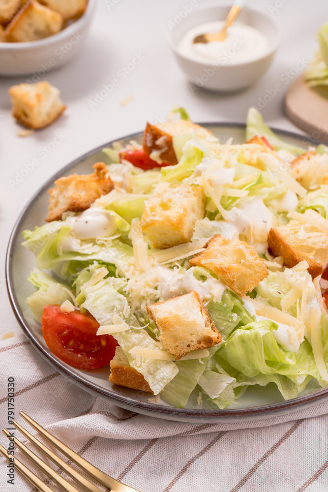 Caesar Salad with Lettuce, Cheese, Cherry Tomatoes and Croutons Caesar Salad with Lettuce, Cheese, Cherry Tomatoes and Croutons