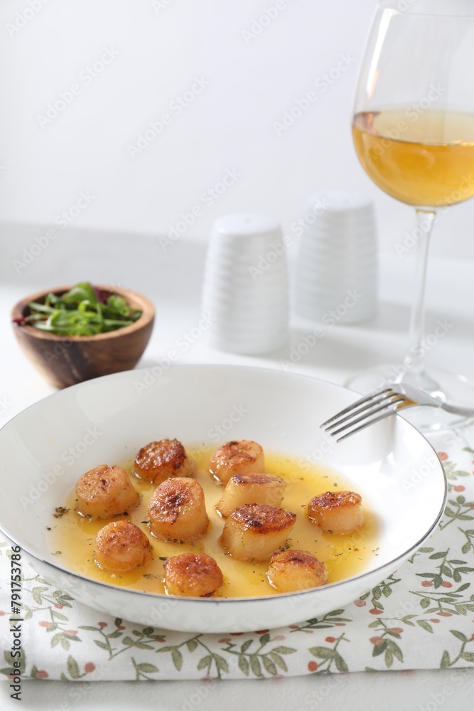 Delicious fried scallops served on white table Delicious fried scallops served on white table