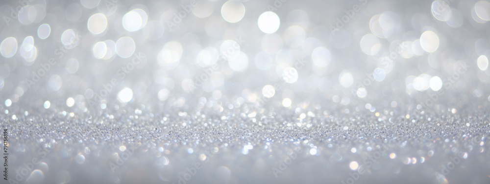 Grey Lights Festive background. Abstract Christmas twinkled bright background with bokeh defocused silver lights Grey Lights Festive background. Abstract Christmas twinkled bright background with bokeh defocused silver lights