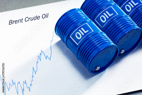 Oil price up growth graph and crude oil barrels fossil fuel petroleum production.