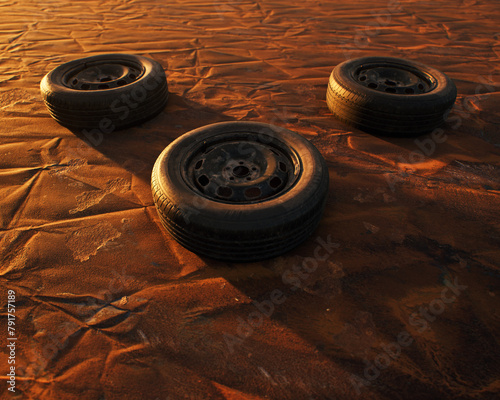 Three old car wheels on weathered rusty painted metal sheet.