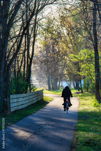 Man in silhouette on the bike trail