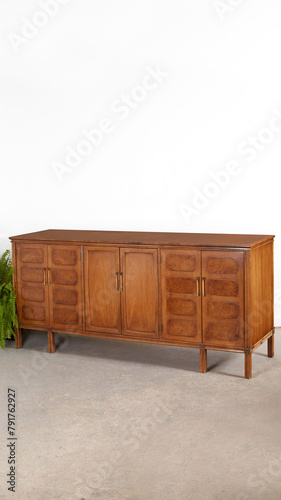 Unique vintage wooden credenza. Art Deco revival sideboard furniture piece. Product photograph.