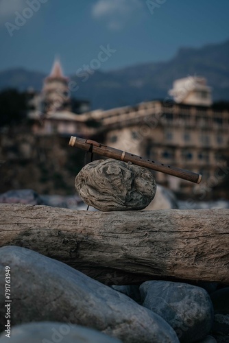beautiful handmade pimak flute lies on a stone in the city of rishikesh india