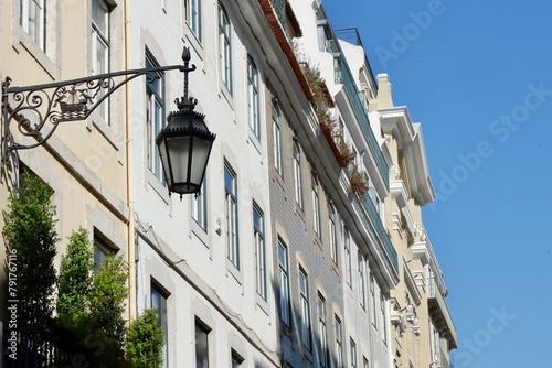 Old fashioned street lamp against traditional facades in Lisbon, Portugal. Portuguese architecture