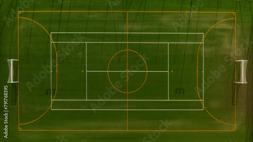 Aerial zenithal view of a multipurpose football field. There is no one and the sports center is empty.
