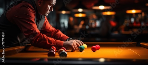 Young man playing billiards in bar. Selective focus. Elderly Billiards Player photo