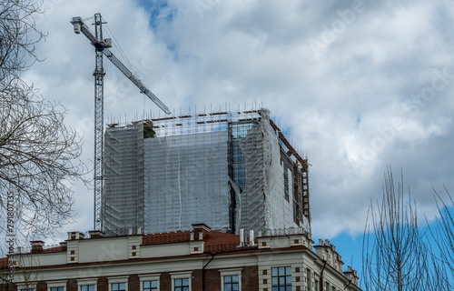 A tower crane on the construction of a high-rise building.