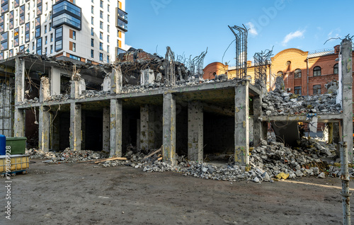 The destruction of an old house by builders in the city center.