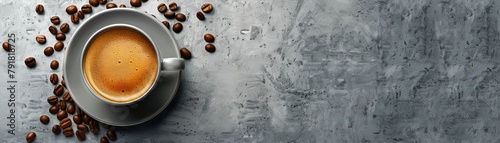 Top view of a cup of coffee on a gray stone table with scattered coffee beans. photo