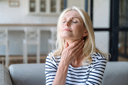 Mature woman with inflammation lymph nodes feeling throat sore © brizmaker