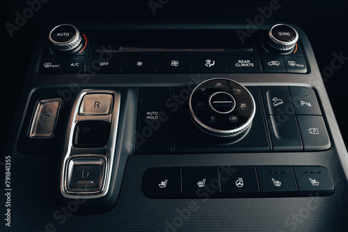 Car control dashboard. New car interiors. Elegant modern navigation panel with buttons. Part of vehicle. Car design. Business class auto design. © Nataliia