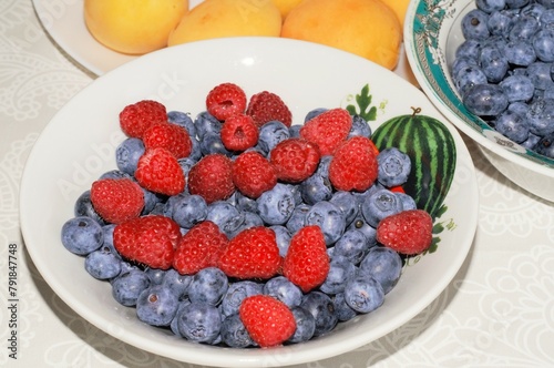 Healthy eating. Fresh blueberries and raspberries on a plate
