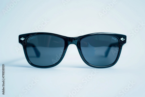 A pair of sleek and modern sunglasses with polarized lenses, providing both style and protection from the summer sun isolated on solid white background.