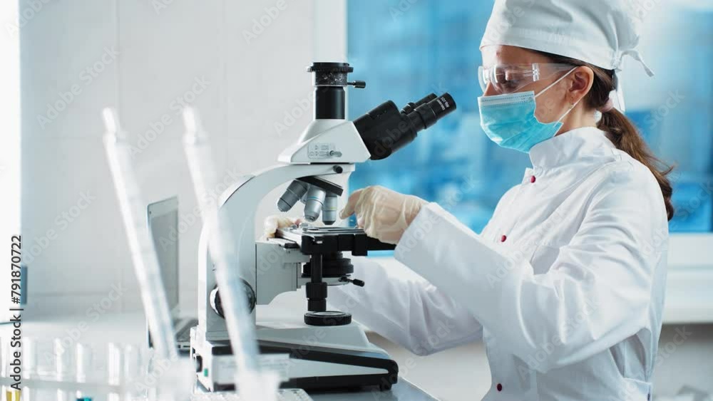 Young scientists conducting research investigations in a medical laboratory Young scientists conducting research investigations in a medical laboratory