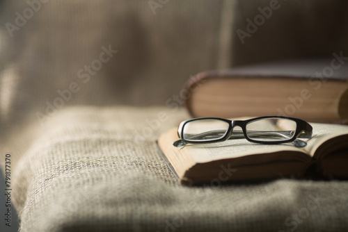 The glasses are on an old book.