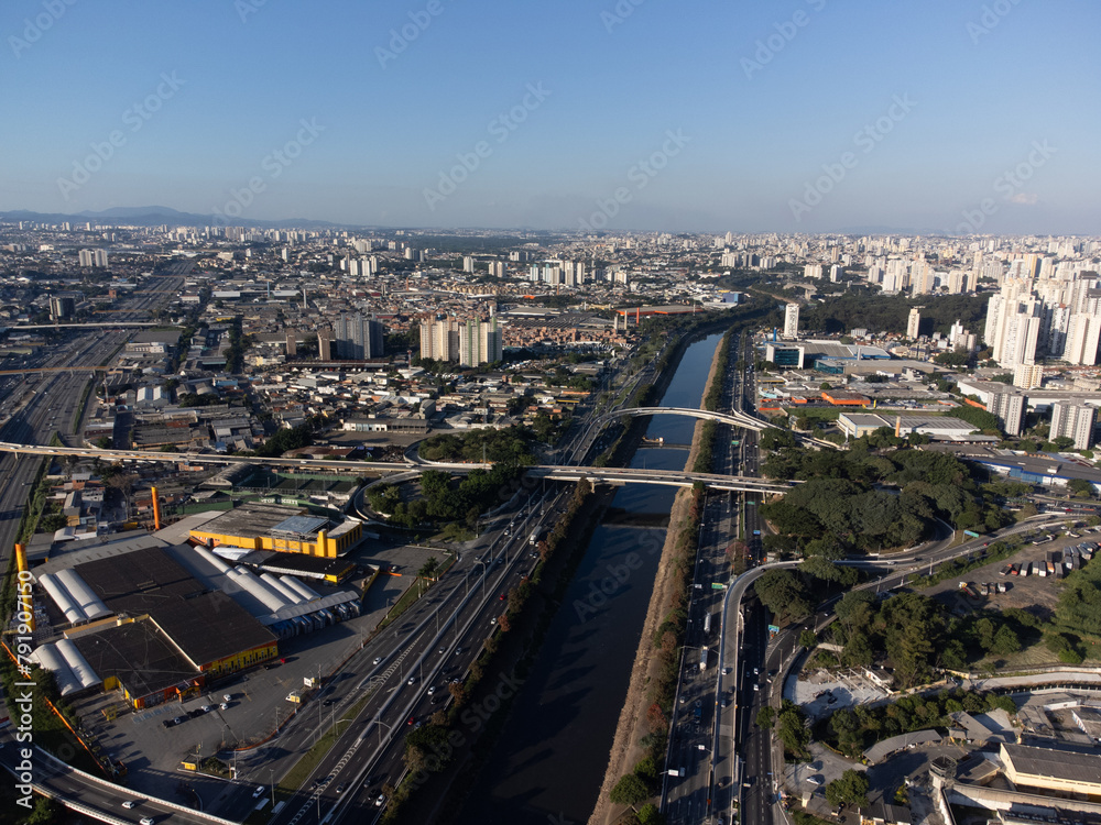 Incredible sunset in the city of São Paulo, a megalopolis with an aerial image above the Tietê River.