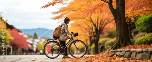 Backpacker in Kyoto: A Vibrant Autumn Reflection with Resting Bike - Travel Photo Stock
