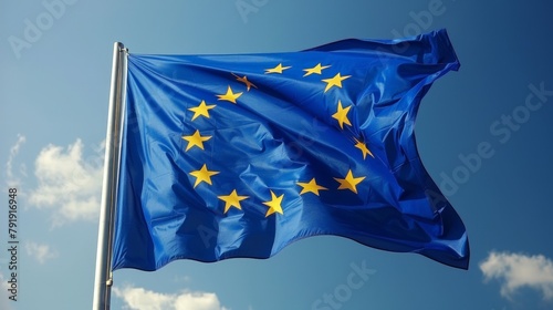 European Union flag waving against a blue sky photo