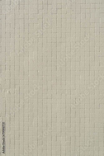 Beige square tiles on the wall. Perfect for background. © michaldziedziak