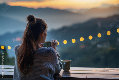 Lonely woman drinking coffee and watching sunset over mountain landscape, photography, art, travel, exterior, romanticism © AdnanArif
