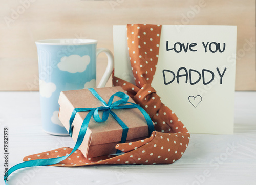 Father's day concept card,gift box ,beverage and tie. Male accessories. Greeting template with message.